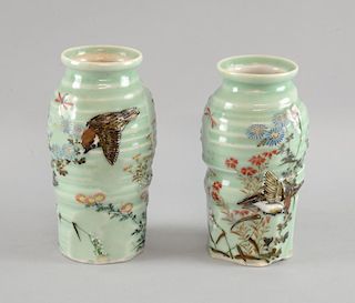 Two Japanese celadon pottery vases decorated in colours with birds in flight and flowers and foliage
