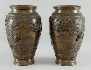 Pair of Japanese bronze vases with applied decoration of birds in trees, marks to bases, 31cm high,