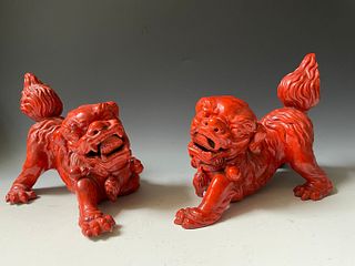 A Pair of Red Glazed Porcelain Lion Foodog