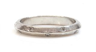 A platinum chevron section diamond set wedding ring,