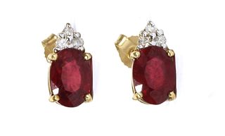 A pair of 9ct gold fracture filled ruby and diamond earrings,