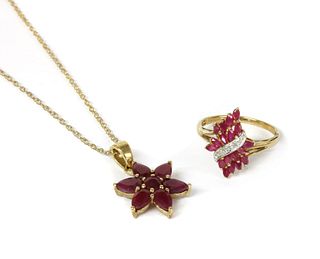 A 9ct gold fracture filled ruby set star cluster pendant,