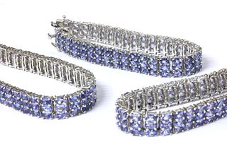 Three matching sterling silver set tanzanite bracelets,