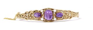 A 9ct gold amethyst and split pearl bangle,
