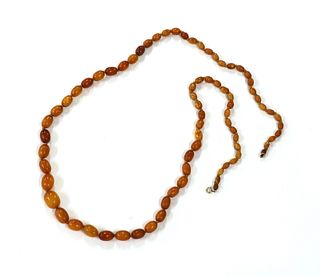 A single row graduated butterscotch amber bead necklace,
