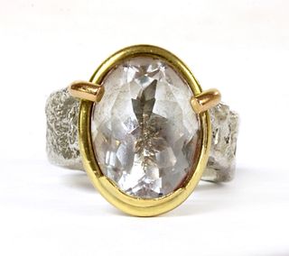 A sterling silver and 18ct gold single stone ring, by Shelley Thomas,
