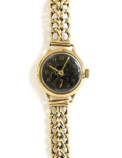 A ladies' 9ct gold Tissot mechanical bracelet watch,