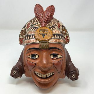Two Feather head dress tribal head figurine