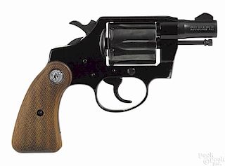 Colt Cobra revolver, .38 special caliber, with blued alloy frame and walnut grips, 2'' barrel