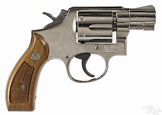 Smith & Wesson Model 10-7 revolver, .38 special caliber, with a nickel finish and walnut grips