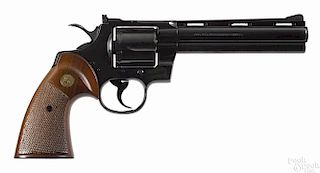 Colt Python revolver, .357 magnum caliber, blued with walnut grips, 6'' round barrel