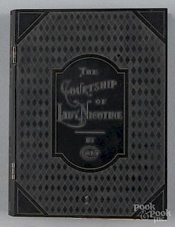 Colt Firearms The Courtship of Lady Nicotine bakelite cigarette box, early 20th c., in book form