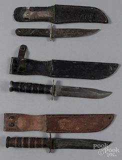 Three knives, to include two Camillus USMC fighting knives and one Remington USMC 5 3/4'' knife