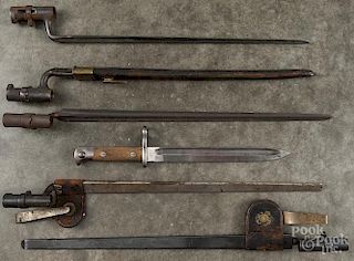 Six bayonets, to include three U.S. trapdoor bayonets, two with scabbards and frogs