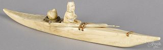 Inuit carved bone kayak, early 20th c., 16'' l.