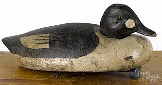Attributed to Billy Ellis, Canadian carved and painted goldeneye duck decoy, early 20th c.