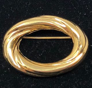 Golden oval brooch pin