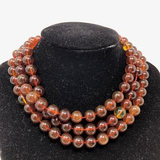 Lovely Dark Amber bead 43 inch necklace with 11" light
