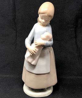 Lladro Nao Girl Holding Baby Doll Figurine.