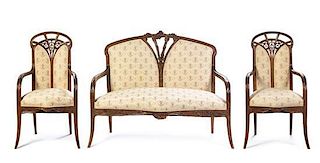 A French Art Nouveau Three Piece Carved Fruitwood Salon Suite, Louis Majorelle Length of settee 51 inches.