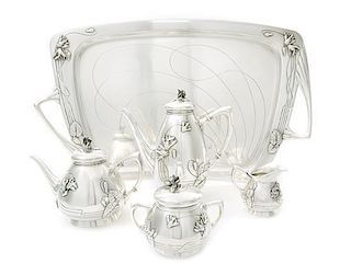 An Austrian Art Nouveau Silver Tea and Coffee Service, CIRCA 1900, comprising a coffee pot, a teapot, a covered sugar, a creamer