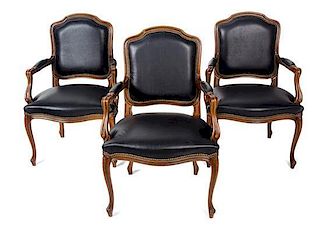 A Set of Three Louis XV Style Walnut Fauteuils Height 39 inches.