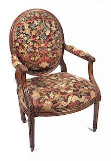A Louis XV Style Walnut Fauteuil Height 40 inches.