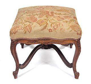 A Louis XV Style Carved Fruitwood Tabouret Height 18 x width 24 1/2 x depth 23 inches.
