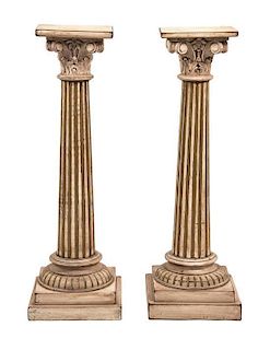 A Pair of Painted and Parcel Gilt Pedestals Height 46 3/4 inches.