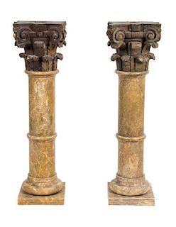A Pair of Faux Marble Pedestals Height 37 inches.