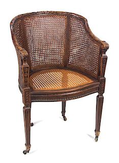 A Louis XVI Style Carved Walnut Bergere Height 33 1/2 inches.