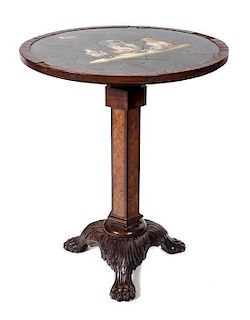 An Italian Walnut Center Table Height 32 x diameter of top 27 inches.