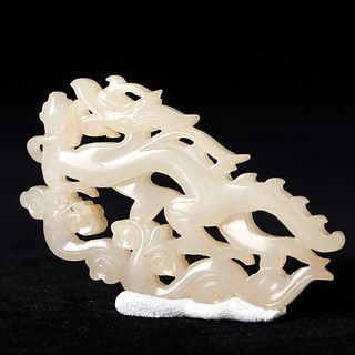 A WHITE JADE 'DRAGON' CARVING