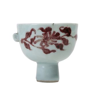 A COPPER-RED FLORAL CUP