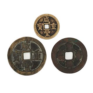 A GROUP OF THREE BRONZE COINS