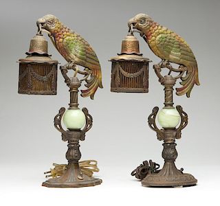 A near-pair of patinated brass parrot lamps