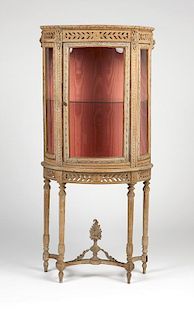 Continental carved and gessoed bow-front vitrine