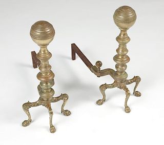 A pair of Continental iron and brass andirons