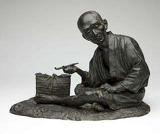 A Japanese bronze figural sculpture