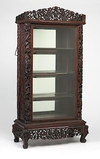 A Chinese carved hardwood vitrine cabinet