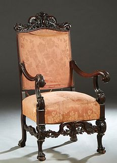 Continental Carved Mahogany Fauteuil a la Reine, late 19th c., the arched pierced leaf carved scrolled crest over an upholstered back, above an uphols