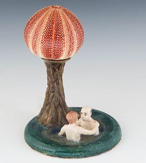 Pat Benard, "Fun in the Hot Tub," 20th/21st c., ceramic lamp with a sea urchin shell shade, signed on the rear of the base, H.- 10 in, Dia.- 7 in.