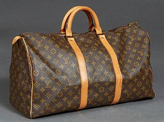 Louis Vuitton Keepall 50 Travel Bag, in brown monogram coated canvas with golden brass hardware and vachetta leather straps, opening to a canvas lined