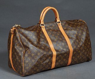 Louis Vuitton Keepall Bandouliere 55 Travel Bag, in a brown coated monogram canvas, with vachetta leather straps and golden brass accents, opening to 