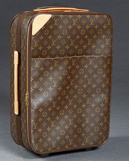 Louis Vuitton Pegase 55 Suitcase, in a brown coated monogram canvas, with vachetta leather accents and golden brass hardware, opening to a brown canva