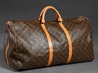 Louis Vuitton Keepall Bandouliere 60 Travel Bag, in a monogram coated canvas, with vachetta leather accents and golden brass hardware, opening to a br