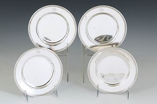 Set of Four American Sterling Bread Plates, 20th c., with a ribbed border, H.- 3/8 in., Dia.- 6 in., Wt.- 12.1 Troy Oz.