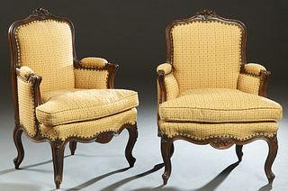 Pair of French Carved Birch Louis XV Style Fauteuils, early 20th c, the arched floral carved upholstered back to upholstered arms and a bowed removabl