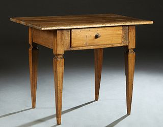 French Provincial Carved Oak Side Table, 19th c., the rectangular top over a wide skirt with a central frieze drawer, on tapered square legs, H.- 33 i
