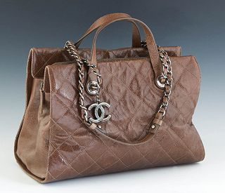 Chanel 31 Rue Cambon Shoulder Bag, in brown quilted caviar calf leather with aged brass hardware, opening to a maroon canvas lined interior with a cen
